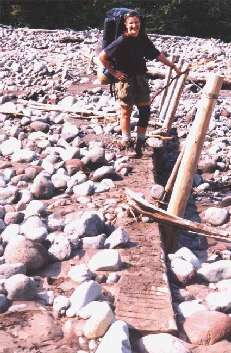 A washed out footbridge at Mowich River. Warm temperatures during the day caused glacial runoff to rise in late afternoon. Good thing that we were crossing early in the morning! washed out footbridge on Mowich River on the Wonderland Trail