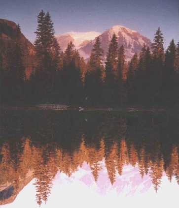 Sun setting on Mount Rainier, as seen by the group of backpackers on the far side of Golden Lakes camp. sun settign on Mt. Rainier viewed from Golden Lakes on the Wonderland Trail